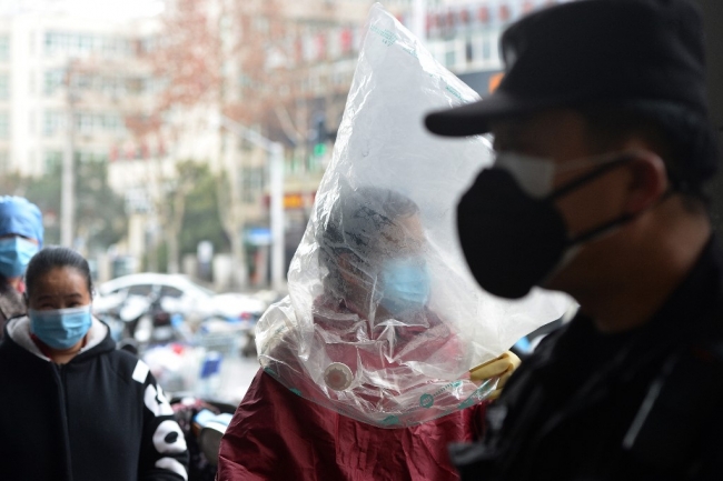 Çin'de vatandaşlar koronavirüse karşı kişisel tedbirlerini almakla yükümlü. | Fotoğraf: AFP